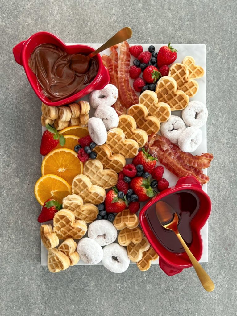 Blogger Sarah Lindner of The House of Sequins sharing Valentine's Day charcuterie board.